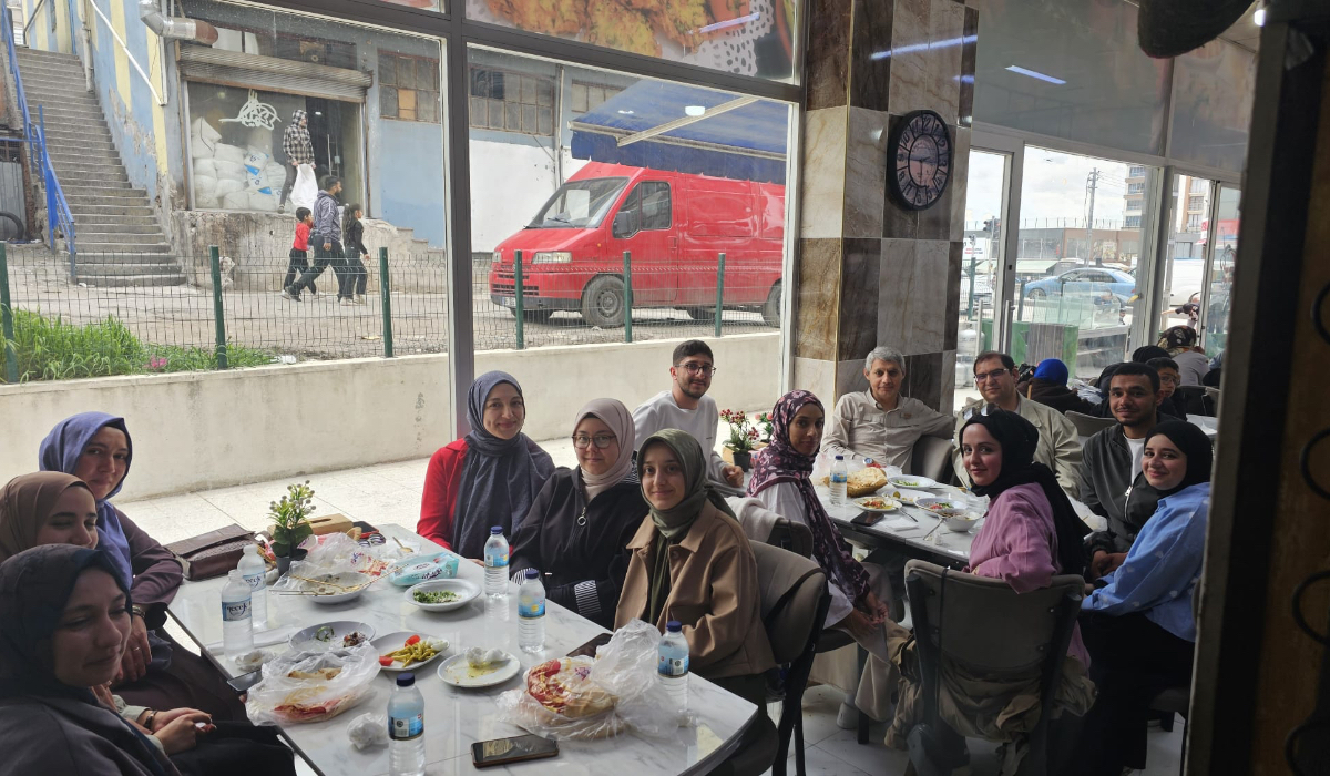 A group photo at the dining table.