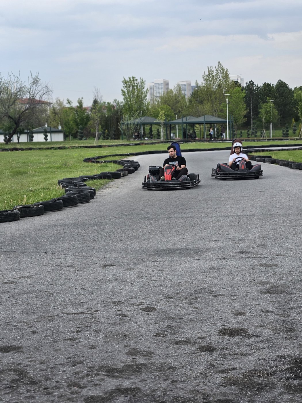Students competing on the go-kart track engage in friendly competition as part of the picnic event.