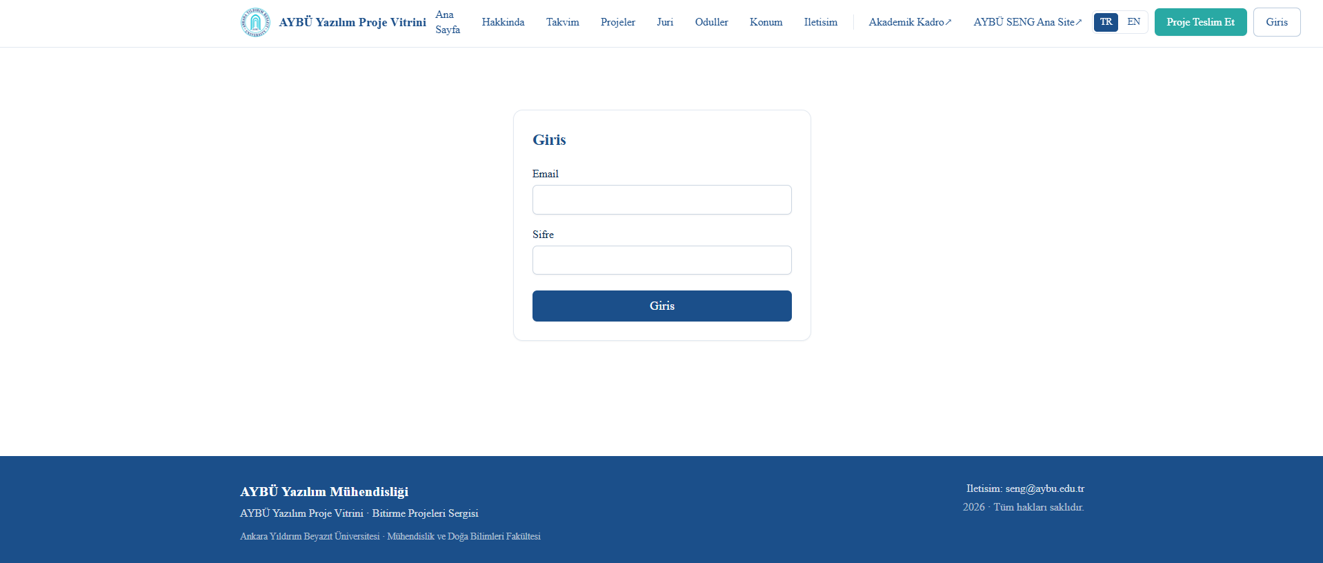 The login page is displayed. It contains email and password fields along with a login button. Department and contact information are shown in the footer section.