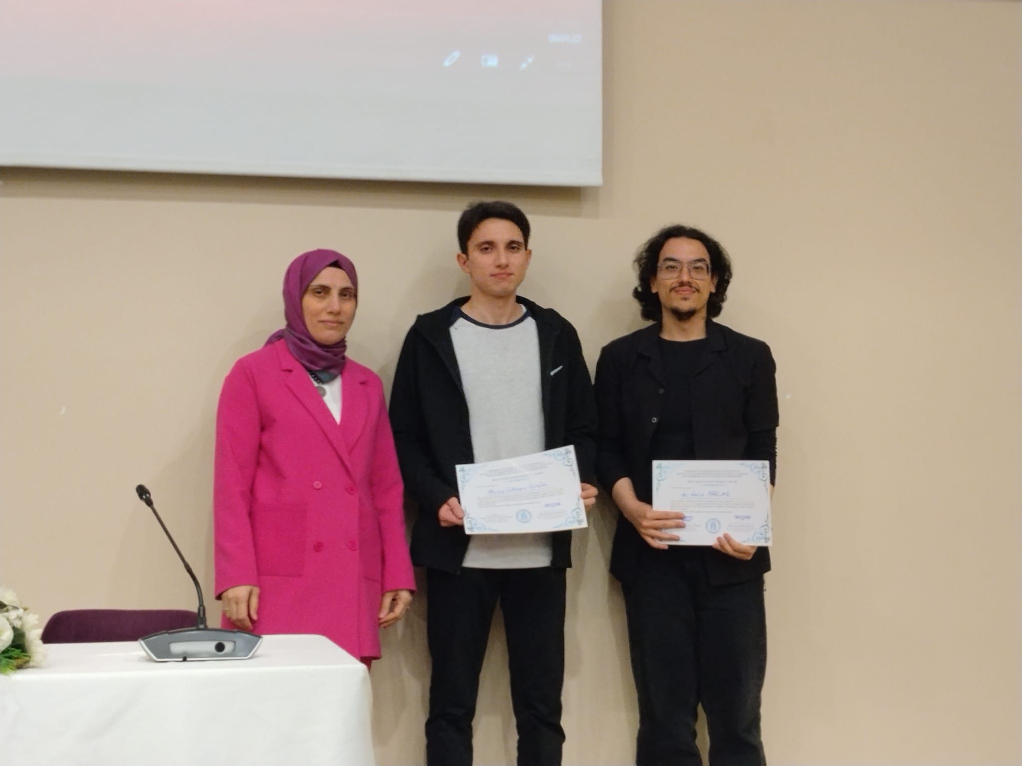 Ahmet Görkem ÇİÇEK and Ali Halit PARLAR, recipients of the second-place Best Graduation Project Award, received their certificates together with their advisor, Assist. Prof. Dr. Fatma KÜÇÜK.