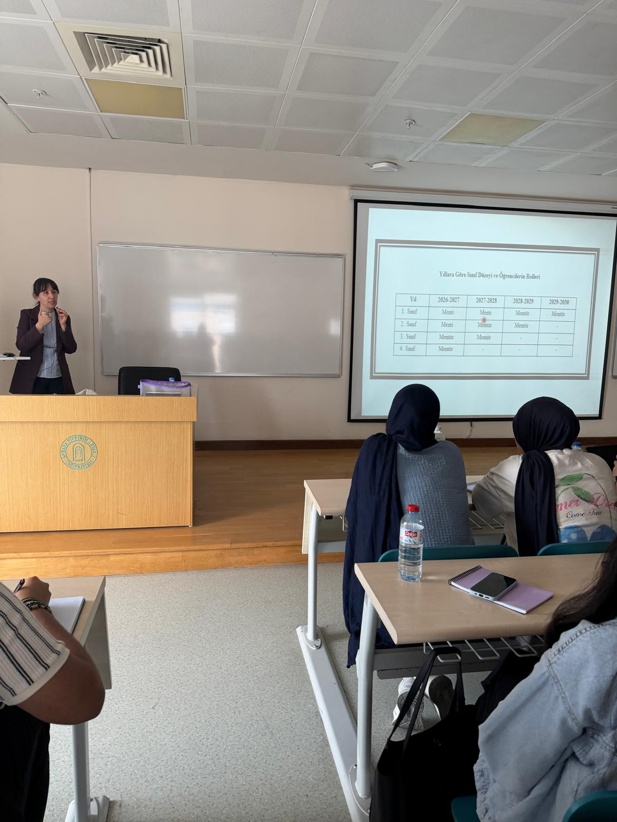 Associate Professor Reyhan Eskiyurt explaining the definitions of mentor and mentee, the scope of the Mentor–Mentee Program, and how the program will be implemented at different year levels to second-year students.