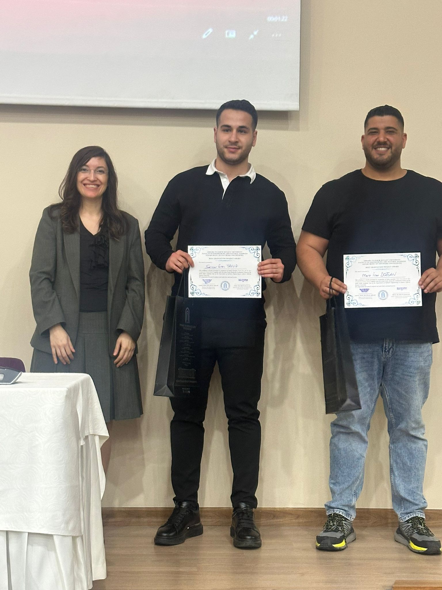 Sencer Eren YAVUZ and Mert İnan DOĞAN, winners of the third-place Best Graduation Project Award, received their certificates from the Head of the Department, Assoc. Prof. Dr. Hilal ARSLAN.