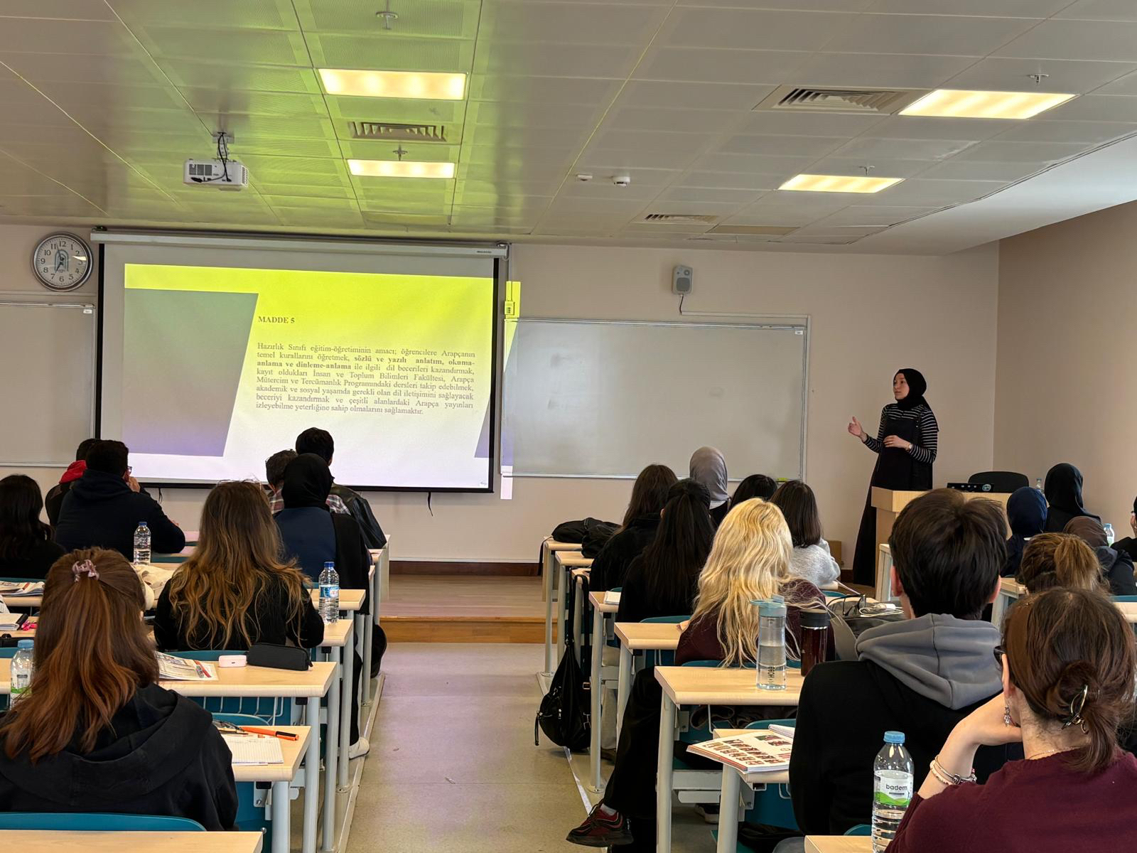 A photo of our faculty member delivering a speech.