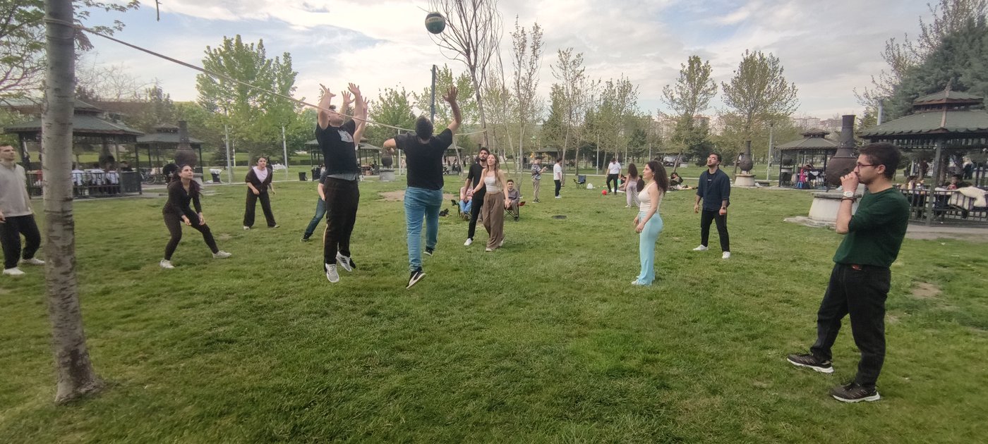 Students enjoy fun moments during the volleyball match attended by Assoc. Prof. Dr. Yenal Arslan.