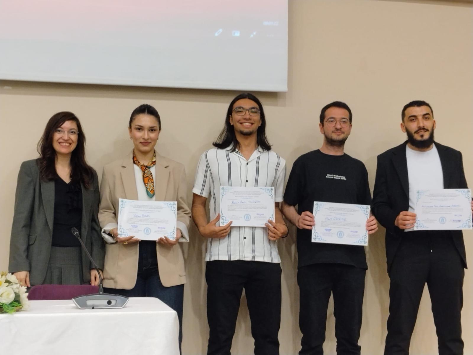 Abdulmajeed ALREMALI, Bekir Berk YILDIRIM, Yaren DİNÇ, and Mert ÖZDEMİR, winners of the Best Graduation Project Award, received their certificates together with their advisor, Assoc. Prof. Dr. Hilal ARSLAN.