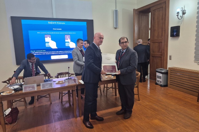 Photograph taken while receiving our faculty member's Certificate of Participation. 