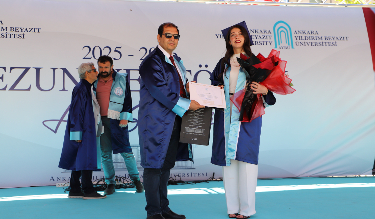 Our second-ranking graduate receives their diploma.